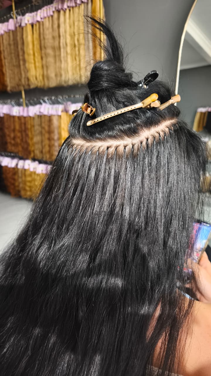 Row of Keratin Bond attachments across a sectioned parting