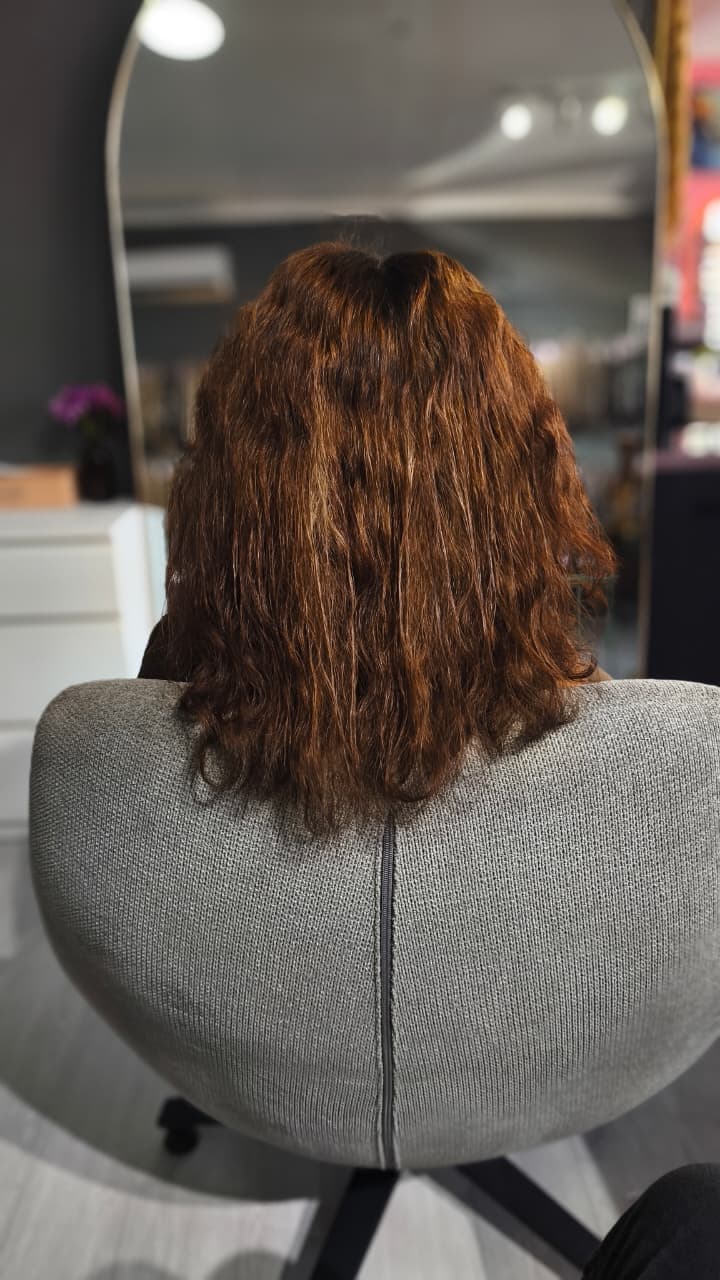 Client before — mid-length copper curls