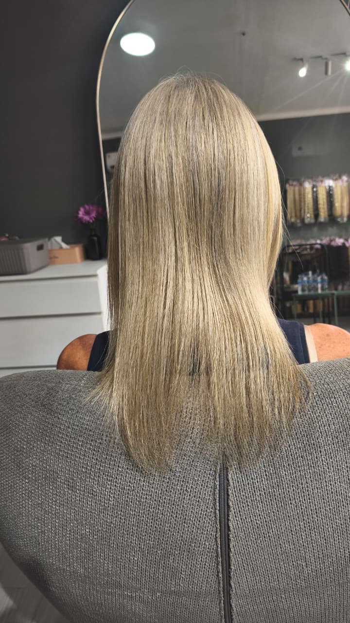 Client before — blonde hair cut to the shoulders