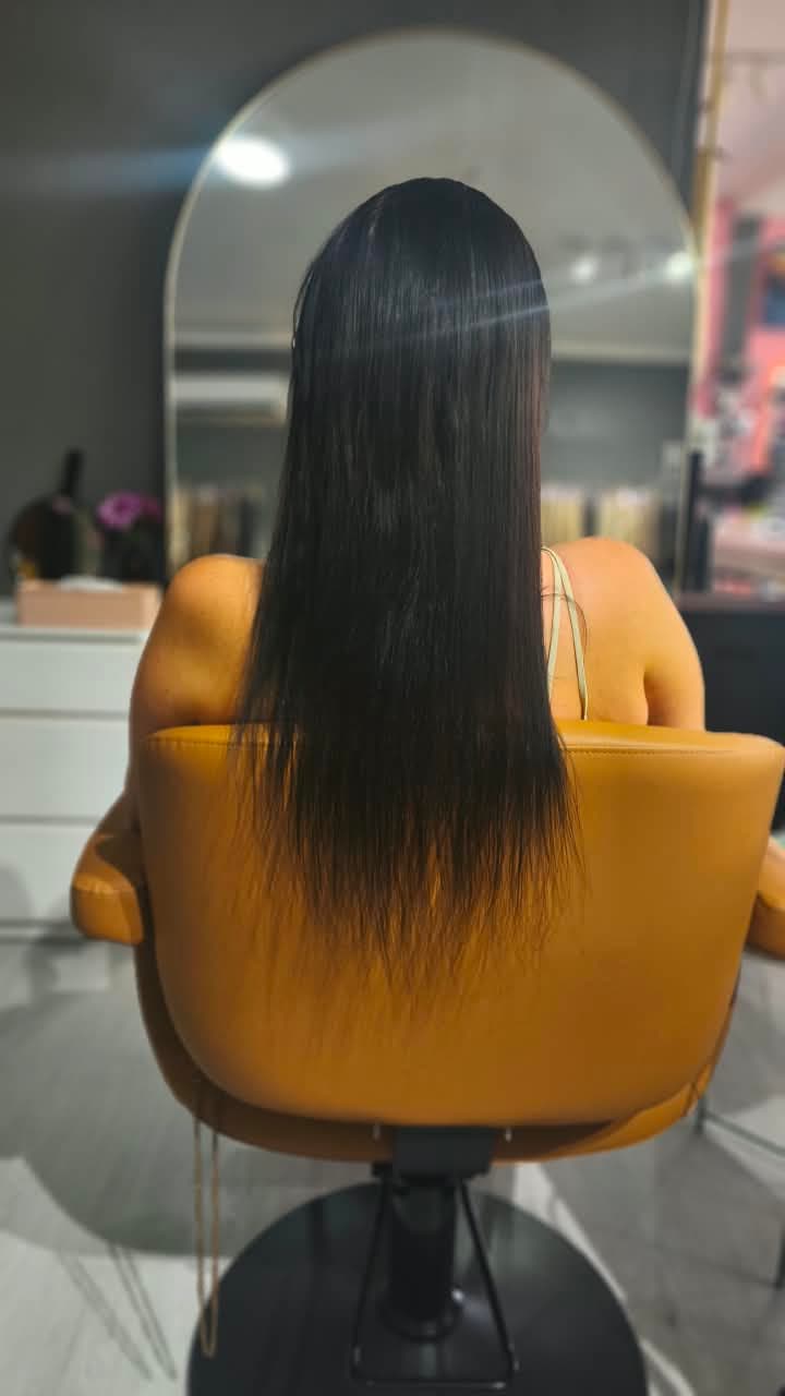Client before — black hair with lighter grown-out ends, to mid-back