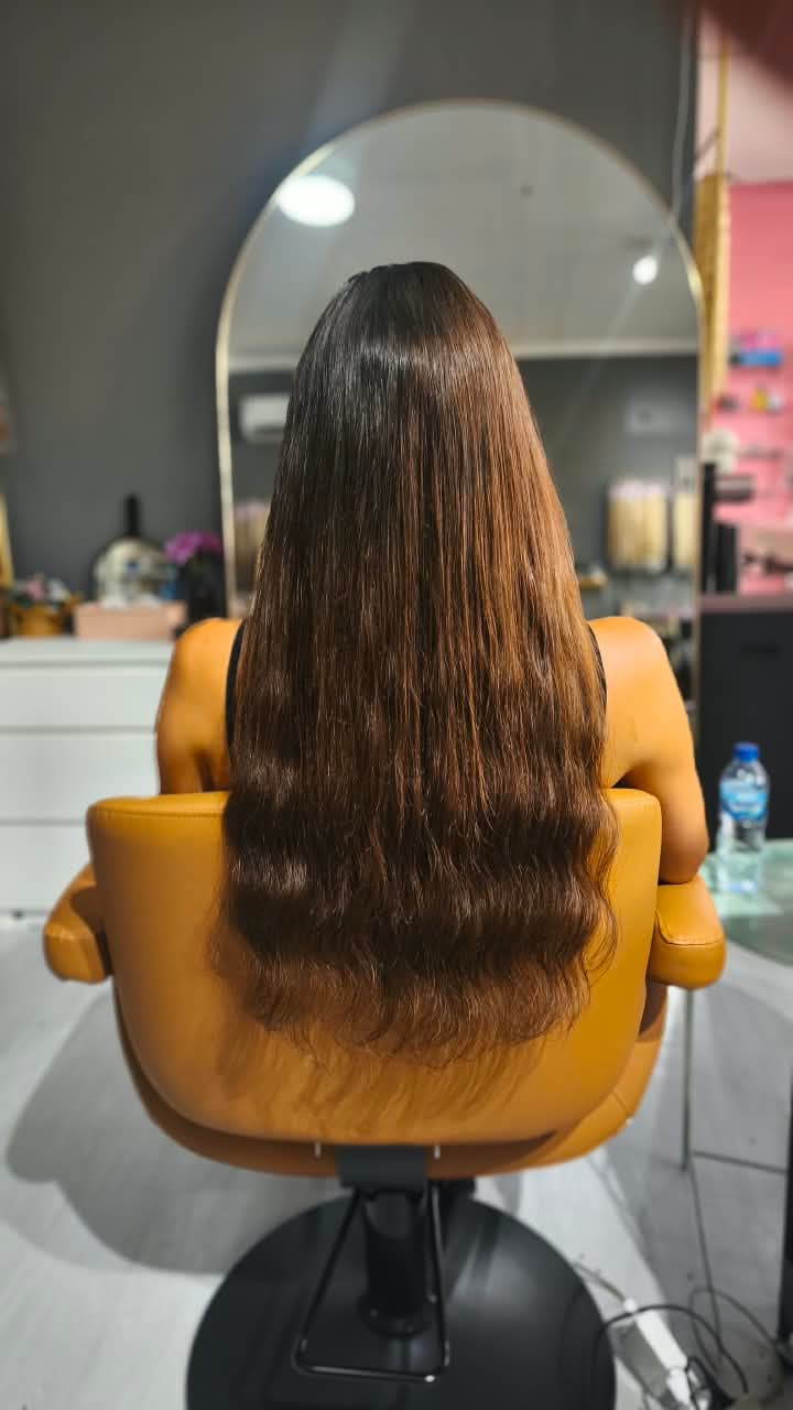 Same client after — thick warm-brown waves past the waist, Keratin Bond double 150 g
