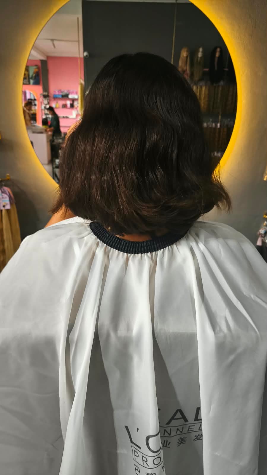 Client before — dark brown bob cut to the jaw