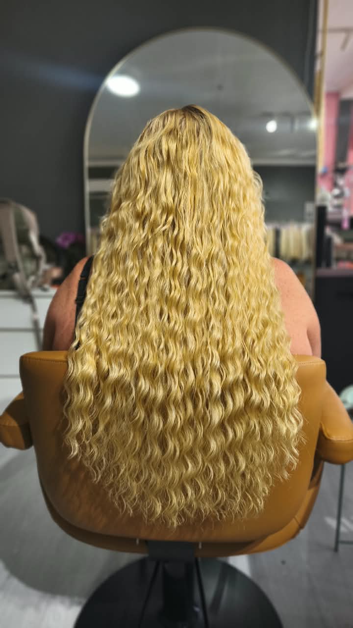 Same client after — long blonde curls past the waist, Keratin Bond double 150 g