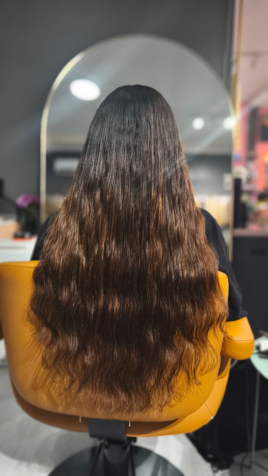 Same client after — long, fuller brown waves, Keratin Bond 100 g