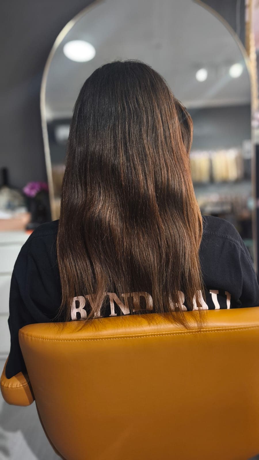 Client before — straight dark brown hair to mid-back