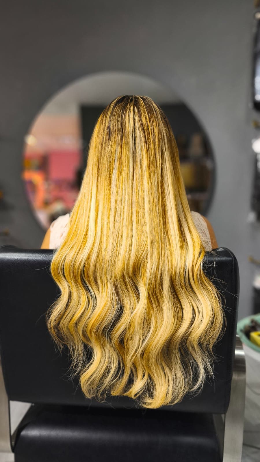 Same client after — honey-blonde styled waves, Keratin Bond 150 g double drawn