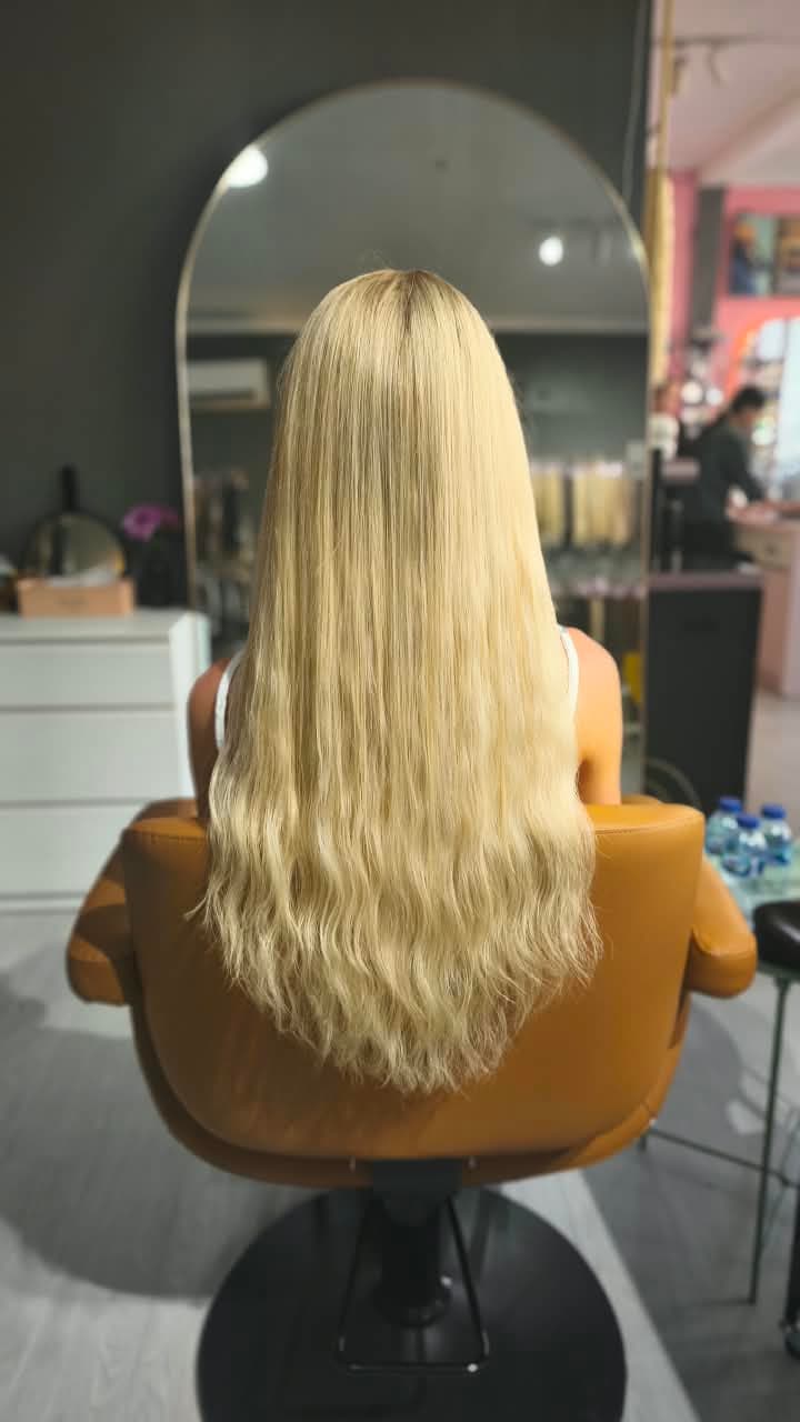 Same client after — platinum blonde length past the waist, full to the ends, Nano Ring double 100 g