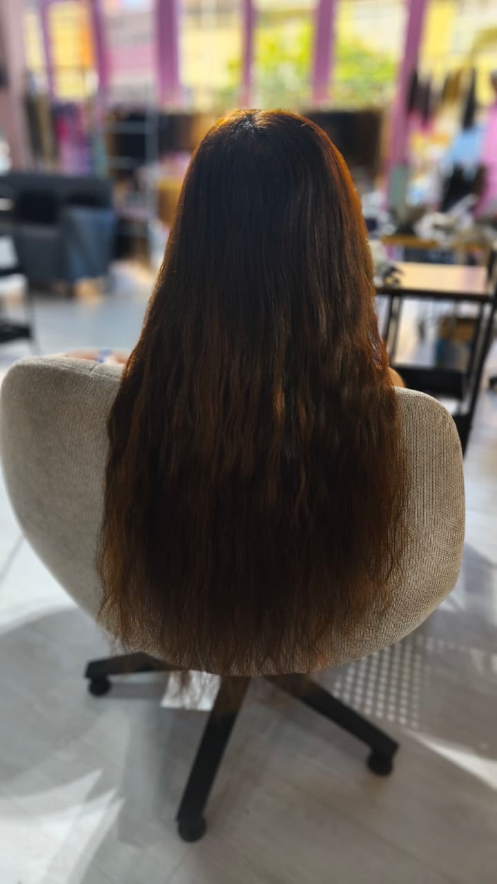 Same client after — long brown waves past the waist, Nano Ring 150 g double drawn