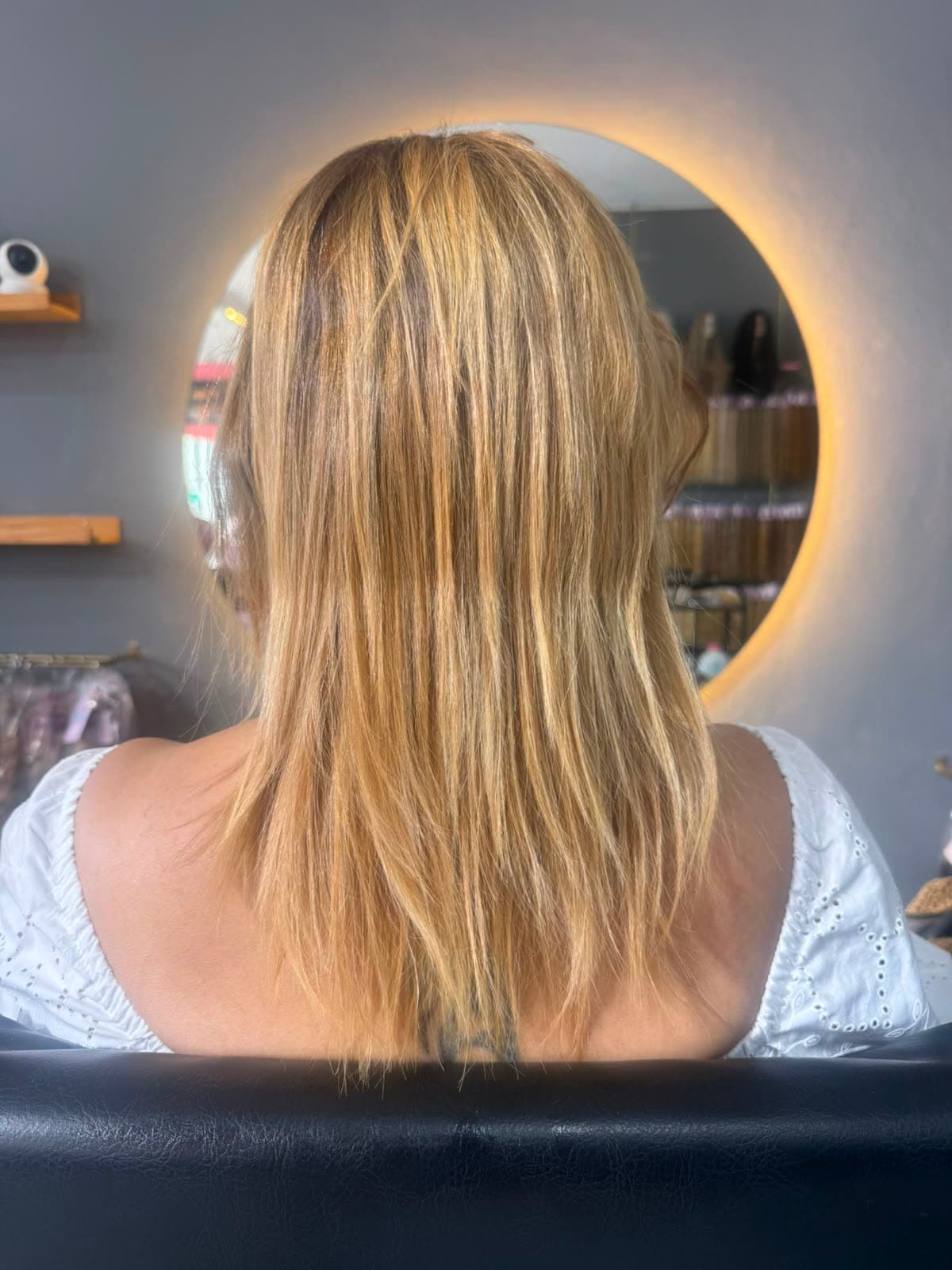 Client before — shoulder-length golden blonde, fine through the ends