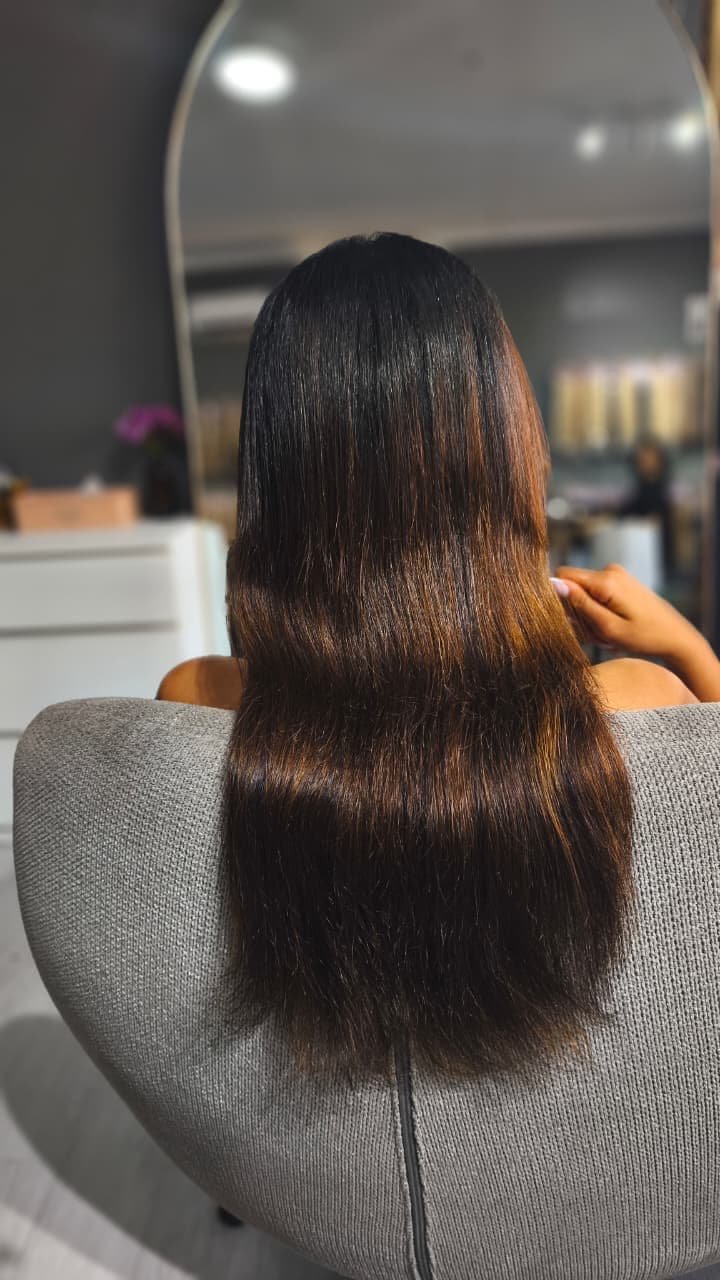 Client before — dark brown hair tapering through the ends