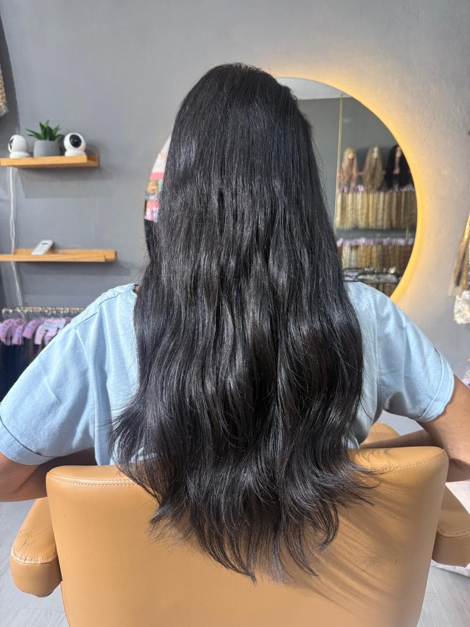 Same client after — long dark waves, smooth from root to tip