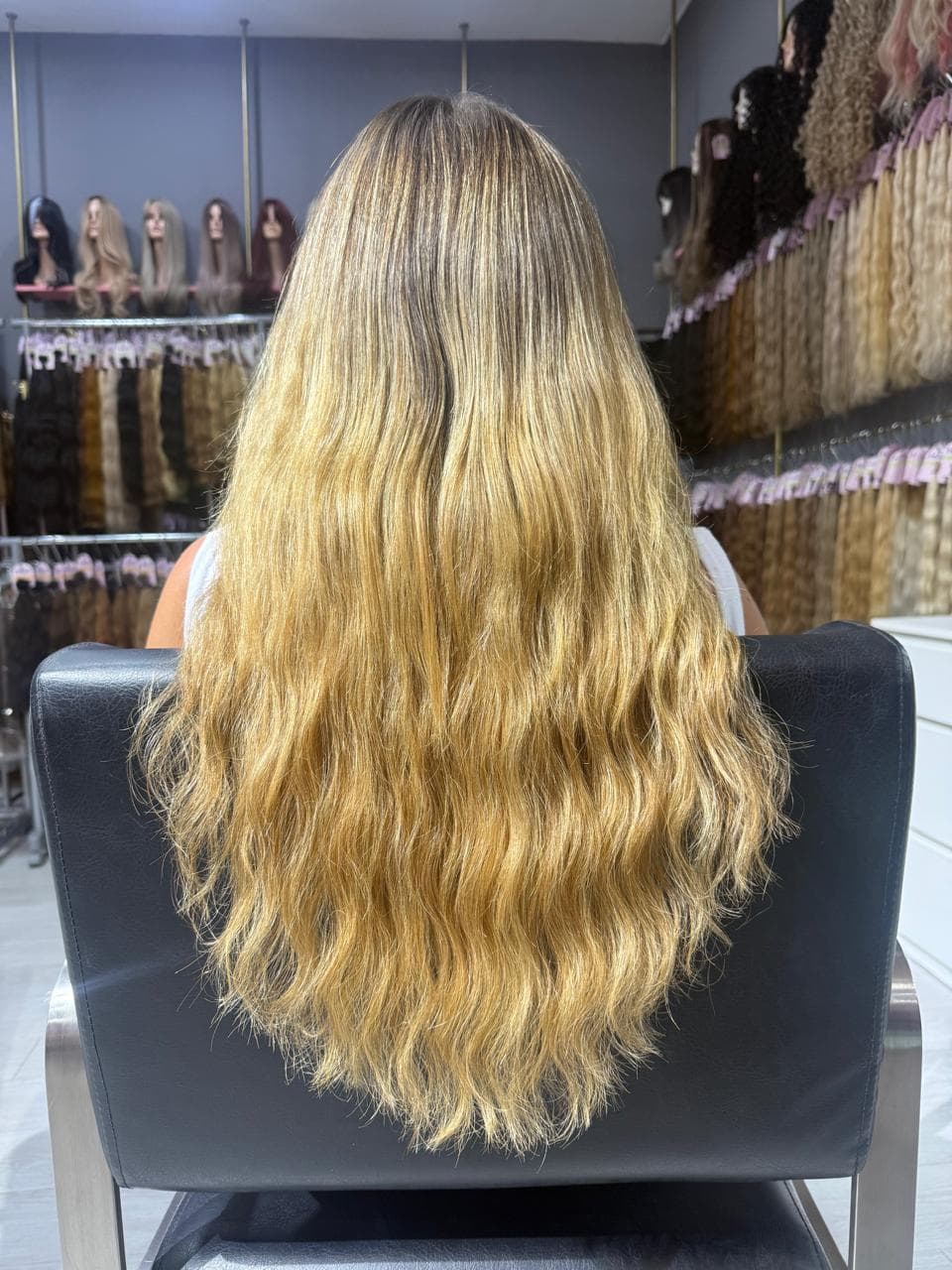 Same client after — long blonde waves with the ombre carried through