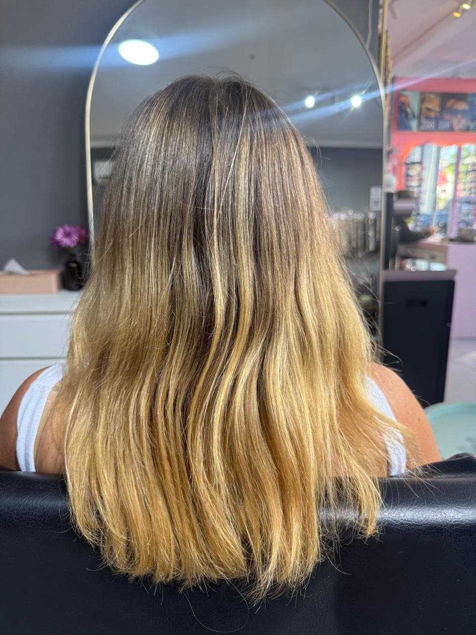 Client before — blonde ombre with grown-out roots, to the shoulder blades