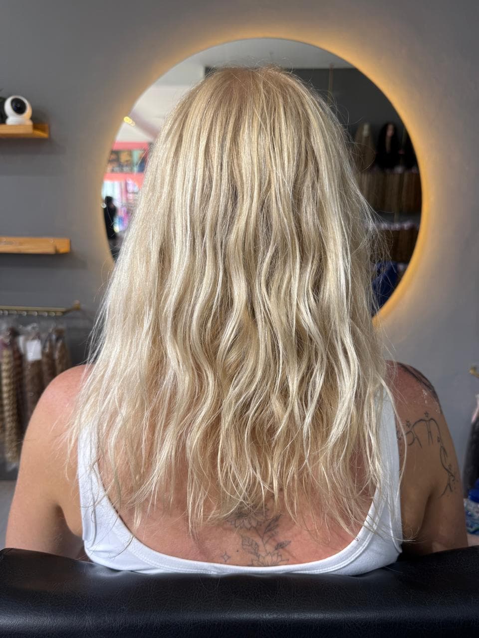 Client before — blonde waves to mid-back