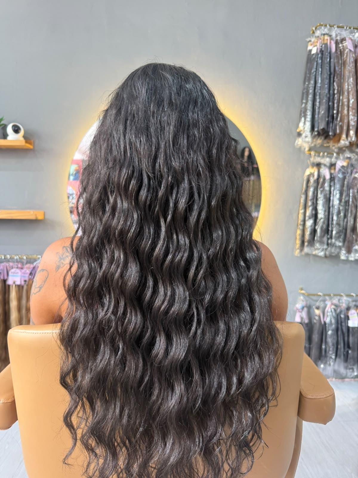 Same client after — long dark curls well past the shoulders