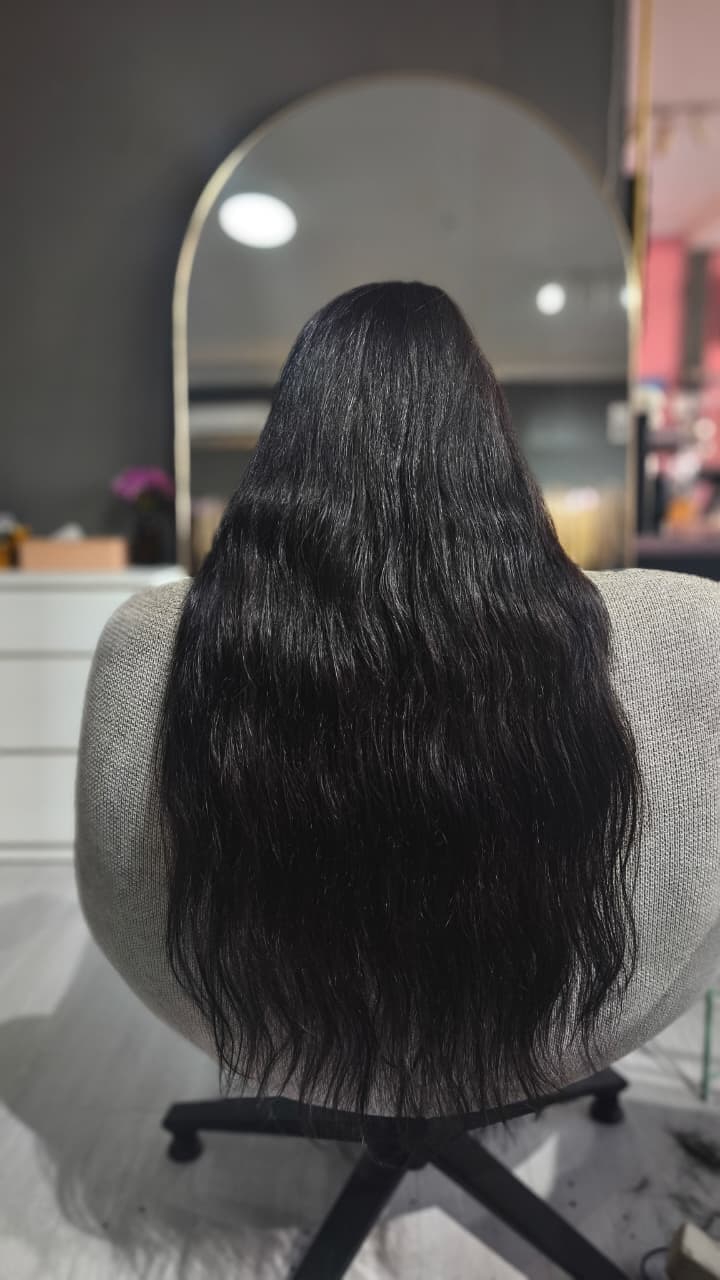 Same client after — long black length past the waist