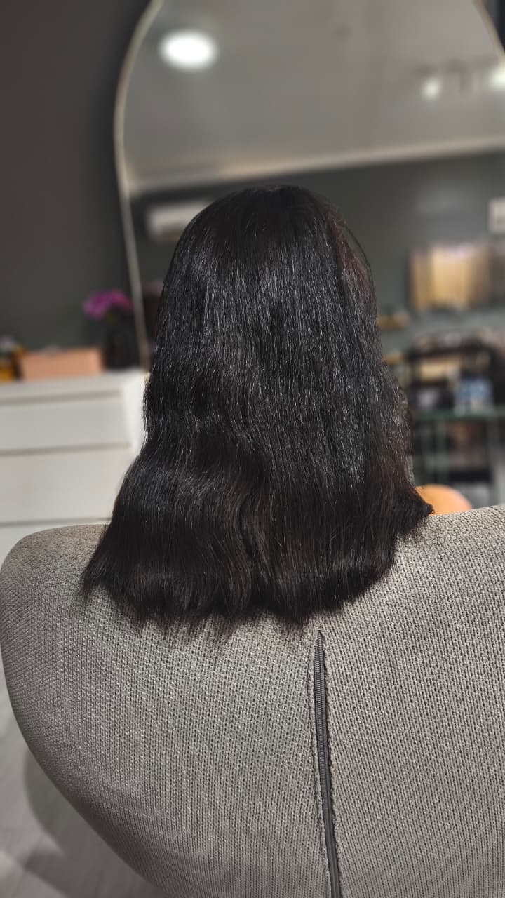 Client before — black hair cut to the shoulders